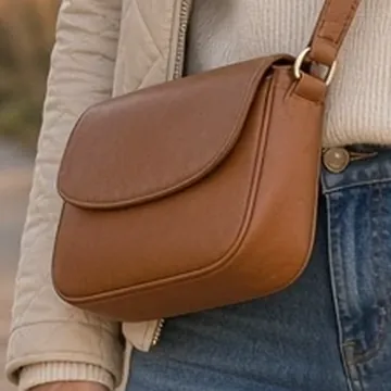 Detail crop of an SI-generated outfit illustration showing a crossbody tote, similar to the listed item, not exact